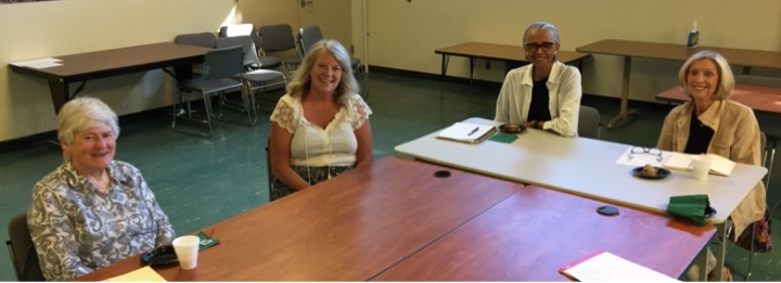 Susan McEwan, Donna MacDonald, Gloria Myers, and Carol Edwards.sitting at a table